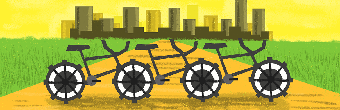 Illustration of bikes on a road leading to a city. Surrounding the city are green fields.