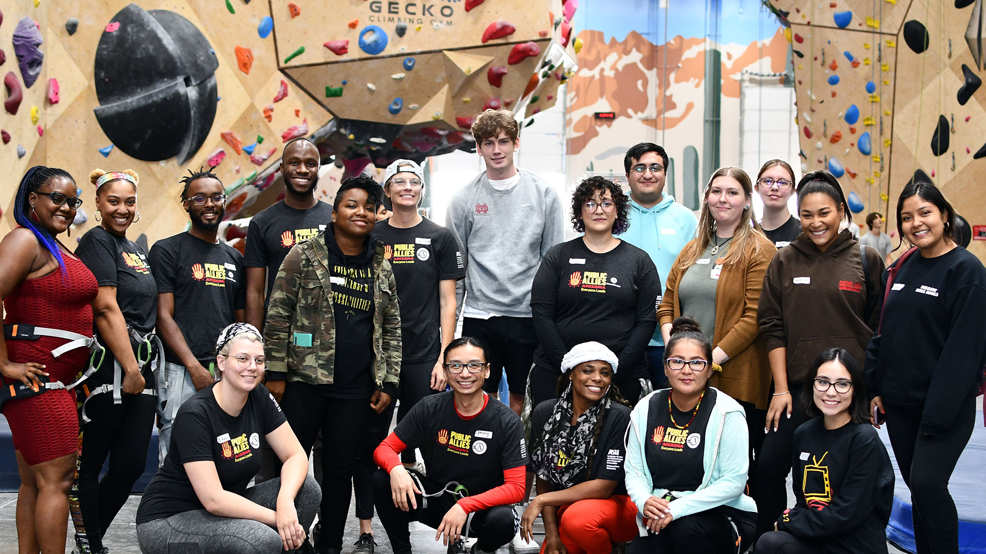 Public Allies members pose for a photo at a climbing gym