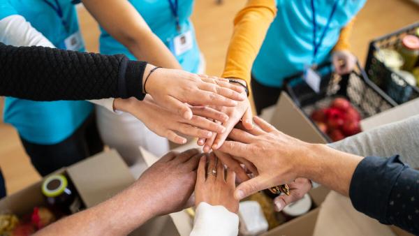 Team members' hands together